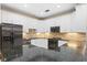 Kitchen boasting granite countertops, stainless steel appliances and updated cabinetry at 6345 Vista Verde E Dr, Gulfport, FL 33707