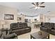 Spacious living room showcasing an open floor plan connecting to the modern kitchen at 6345 Vista Verde E Dr, Gulfport, FL 33707