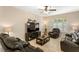 Inviting seating area with large-screen TV and comfortable reclining furniture at 6345 Vista Verde E Dr, Gulfport, FL 33707