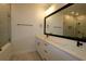 Bathroom with double vanity, black hardware, and a glass-enclosed shower at 6605 N Nebraska Ave # 29, Tampa, FL 33604