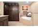 Bathroom featuring granite counters, custom cabinets, tile floors, and a soaking tub at 7069 Key Haven Rd # 205, Seminole, FL 33777