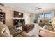 Comfortable living room with reclining leather sofas and access to the screened lanai at 7069 Key Haven Rd # 205, Seminole, FL 33777