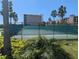 Community tennis courts and palm trees at 7069 Key Haven Rd # 205, Seminole, FL 33777