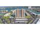 Spectacular aerial view of beachfront high-rise with tennis courts, pool and parking at 7300 Sun Island S Dr # 802, South Pasadena, FL 33707
