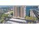 Scenic aerial shot of the waterfront condo building highlighting its boat access, pool, and convenient parking in a vibrant coastal setting at 7300 Sun Island S Dr # 802, South Pasadena, FL 33707