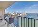 Relax on this condominium balcony, offering seating and stunning waterfront views at 7300 Sun Island S Dr # 802, South Pasadena, FL 33707