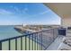 Balcony view of water, waterfront neighborhood, and blue sky on a sunny day at 7300 Sun Island S Dr # 802, South Pasadena, FL 33707