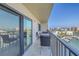 Balcony featuring cushioned chairs, table, railing with views of waterfront neighborhood at 7300 Sun Island S Dr # 802, South Pasadena, FL 33707