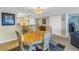 Inviting dining room with seating for four, adjacent to kitchen, and featuring tile flooring at 7300 Sun Island S Dr # 802, South Pasadena, FL 33707