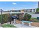 Community grilling area near the water with a stone bench and well-maintained landscaping, perfect for outdoor cooking and relaxation at 7300 Sun Island S Dr # 802, South Pasadena, FL 33707