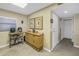 Neutral hallway with tile floors, buffet table and art at 7300 Sun Island S Dr # 802, South Pasadena, FL 33707