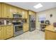 Bright kitchen with stainless steel appliances, granite countertops and tile flooring at 7300 Sun Island S Dr # 802, South Pasadena, FL 33707