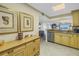 Kitchen flows into living area with granite countertops and stainless steel appliances at 7300 Sun Island S Dr # 802, South Pasadena, FL 33707