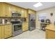 Bright kitchen with stainless steel appliances, granite countertops and tile flooring at 7300 Sun Island S Dr # 802, South Pasadena, FL 33707