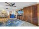Open-concept living area with dining space, built-in Murphy bed, and tile floors at 7300 Sun Island S Dr # 802, South Pasadena, FL 33707