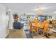 Open concept living and dining area with tile floors, ceiling fan, and water view at 7300 Sun Island S Dr # 802, South Pasadena, FL 33707