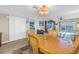 Open concept living and dining area with tile floors, ceiling fan, and water view at 7300 Sun Island S Dr # 802, South Pasadena, FL 33707