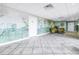 Condominium lobby area with floor tiling, an artistic mural, seating, and doors to unit entryways at 7300 Sun Island S Dr # 802, South Pasadena, FL 33707
