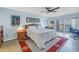 Comfortable main bedroom with a king bed, balcony access, and scenic water views at 7300 Sun Island S Dr # 802, South Pasadena, FL 33707