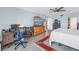 Bright main bedroom featuring a ceiling fan and home office area at 7300 Sun Island S Dr # 802, South Pasadena, FL 33707