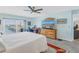 Inviting main bedroom with water view, work desk, and warm natural light at 7300 Sun Island S Dr # 802, South Pasadena, FL 33707