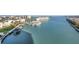 A picturesque waterfront view features boat docks and buildings in the distance with a sunny sky above at 7300 Sun Island S Dr # 802, South Pasadena, FL 33707