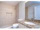 Bathroom with tiled shower stall and granite vanity countertop at 8907 Ashford Gables, Tampa, FL 33626