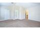 Spacious bedroom with carpet, multiple windows, and en suite bathroom at 8907 Ashford Gables, Tampa, FL 33626