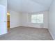 Bedroom with carpet, natural light, and en suite bathroom at 8907 Ashford Gables, Tampa, FL 33626
