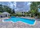 Inviting community pool with comfortable seating, perfect for relaxation and socializing with neighbors at 8907 Ashford Gables, Tampa, FL 33626