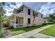 Charming two-story home with well-maintained landscaping and covered porch at 8907 Ashford Gables, Tampa, FL 33626