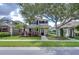 Charming two-story home with a landscaped front yard, mature trees, and inviting curb appeal in a desirable community at 8907 Ashford Gables, Tampa, FL 33626