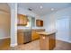 Bright kitchen featuring stainless steel appliances, granite countertops, tile flooring, and a center island at 8907 Ashford Gables, Tampa, FL 33626