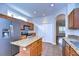Well-lit kitchen with granite countertops, stainless steel appliances, and tile flooring at 8907 Ashford Gables, Tampa, FL 33626