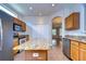 Open kitchen with granite countertops, tile flooring, an island, and stainless steel appliances at 8907 Ashford Gables, Tampa, FL 33626