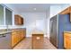 Kitchen featuring stainless steel appliances, granite countertops, tile flooring, and a center island at 8907 Ashford Gables, Tampa, FL 33626
