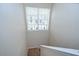 Bright stairway leading up, illuminated by a large window at 8907 Ashford Gables, Tampa, FL 33626