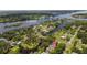 An aerial view showcases a home near the Alafia River, complete with lush greenery and waterfront access at 9501 Alice Ln, Riverview, FL 33578