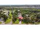 An aerial view highlights the property's proximity to I-75, with green trees and waterfront views at 9501 Alice Ln, Riverview, FL 33578