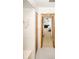 Classic bathroom with neutral tile, shower, and doorway leading to a bedroom at 9501 Alice Ln, Riverview, FL 33578