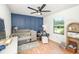 Cozy Bedroom with a crib, chair, and natural light at 9501 Alice Ln, Riverview, FL 33578