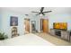 A bedroom showcasing light blue walls, carpeting, and neutral decor at 9501 Alice Ln, Riverview, FL 33578