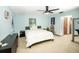 Comfortable bedroom features ample natural light, calming color palette, and closet space for a peaceful retreat at 9501 Alice Ln, Riverview, FL 33578