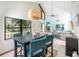 Open concept dining and living area with views of the lake through large windows at 9501 Alice Ln, Riverview, FL 33578