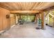 Spacious garage featuring ample storage, a comfortable seating area, and scenic backyard views, blending functionality at 9501 Alice Ln, Riverview, FL 33578