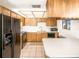 Traditional kitchen with wood cabinets, stainless steel appliances, and lots of counterspace at 9501 Alice Ln, Riverview, FL 33578