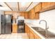 Classic kitchen with ample cabinet space, white countertops, and modern appliances, perfect for home cooking at 9501 Alice Ln, Riverview, FL 33578