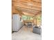 Covered patio area with outdoor seating and built-in cabinets at 9501 Alice Ln, Riverview, FL 33578
