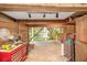 Spacious garage with room for storage and projects, offering a functional space with views of the backyard at 9501 Alice Ln, Riverview, FL 33578