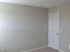 Clean and bright bedroom with neutral paint and door at 10111 Rosemary Leaf Ln, Riverview, FL 33578